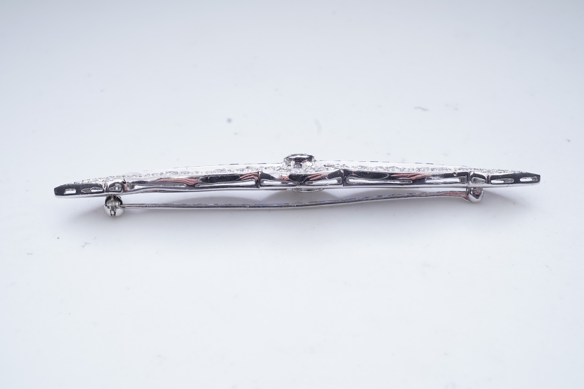 A sapphire and diamond bar brooch